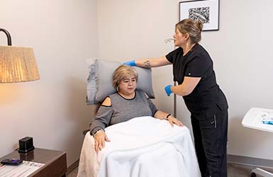 Nurse helping a patient at Specialty Infusion Center